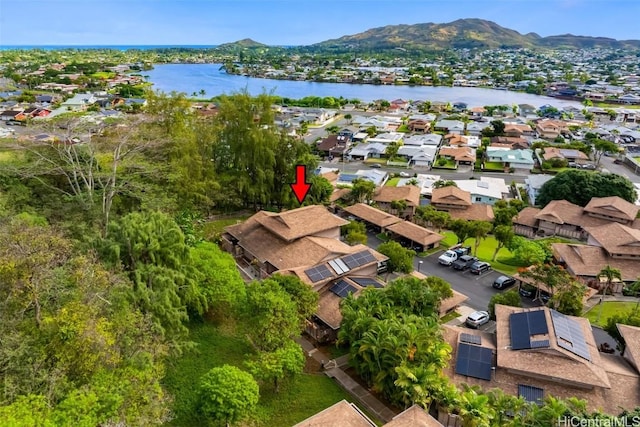 drone / aerial view featuring a water and mountain view