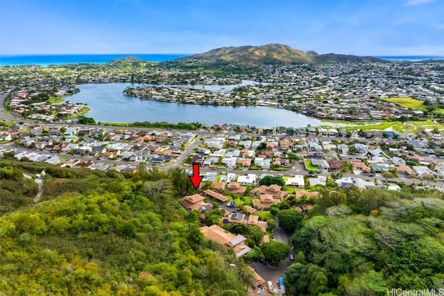 birds eye view of property with a water view