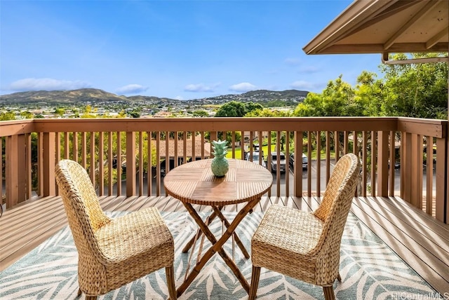 wooden terrace featuring a mountain view