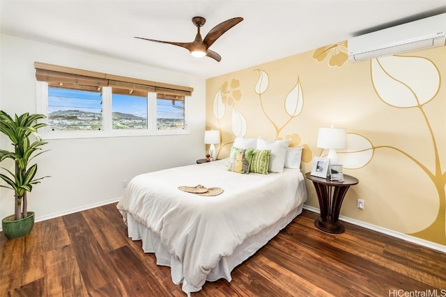 bedroom with dark wood-type flooring, a wall mounted AC, and ceiling fan