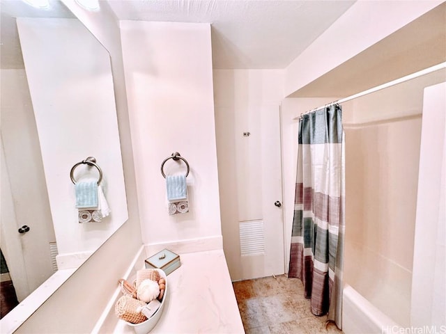 bathroom featuring shower / bath combination with curtain