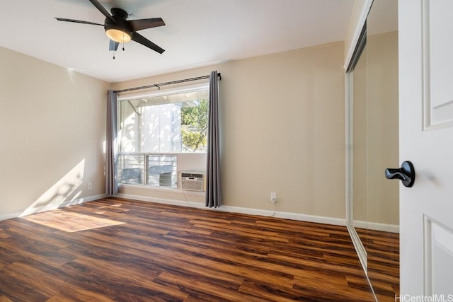 empty room featuring dark hardwood / wood-style floors and ceiling fan