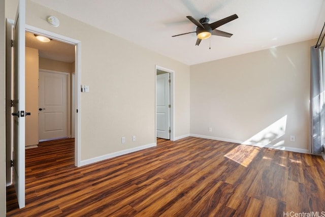 unfurnished bedroom with dark wood-type flooring and ceiling fan