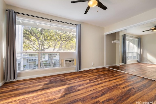 unfurnished bedroom with ceiling fan, multiple windows, and a closet