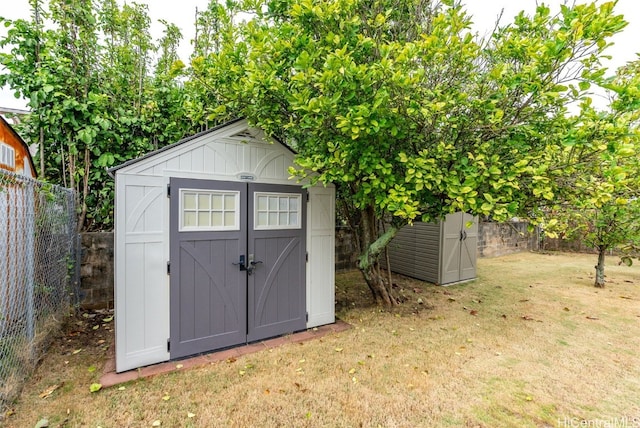 view of outbuilding featuring a lawn