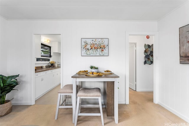 dining space with light carpet