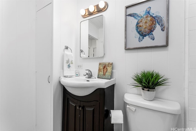 bathroom with toilet and vanity