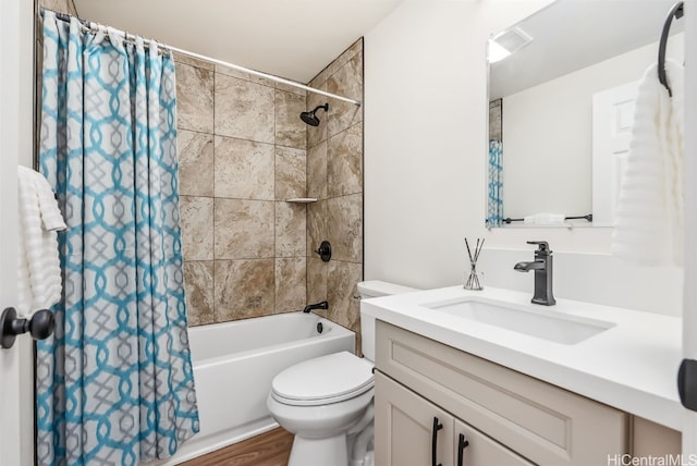 full bathroom with shower / bathtub combination with curtain, vanity, hardwood / wood-style flooring, and toilet