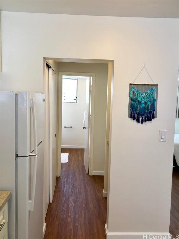 hallway featuring dark wood-type flooring