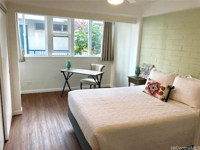 bedroom featuring dark wood-type flooring and ceiling fan