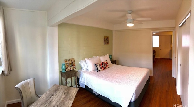 bedroom with dark wood-type flooring and ceiling fan