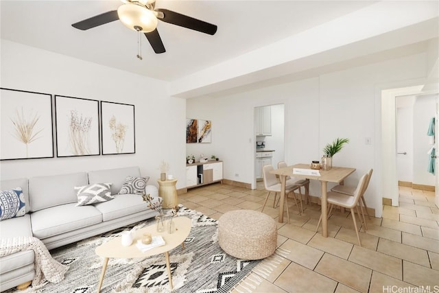 tiled living room with ceiling fan