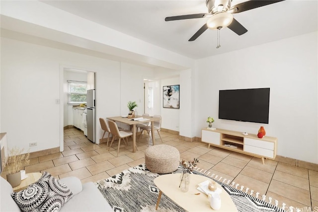 tiled living room featuring ceiling fan