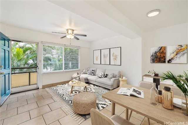 tiled living room featuring ceiling fan