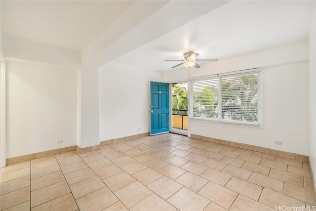 tiled empty room with ceiling fan