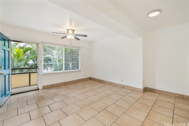 tiled empty room with ceiling fan