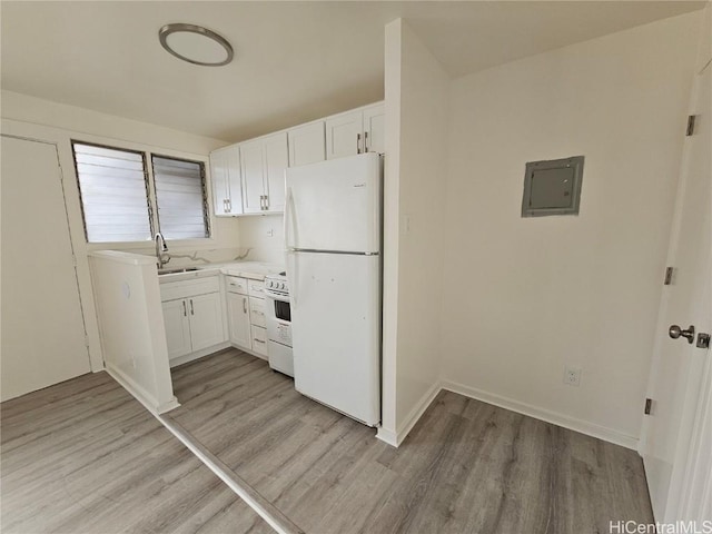 kitchen featuring white appliances, electric panel, light hardwood / wood-style flooring, and white cabinets