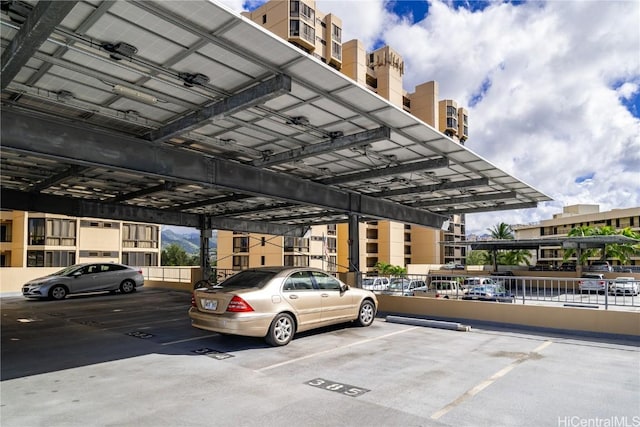 view of parking / parking lot featuring a carport