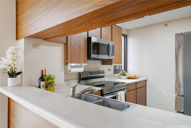 kitchen with appliances with stainless steel finishes and sink