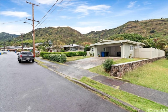 exterior space featuring a carport and a mountain view