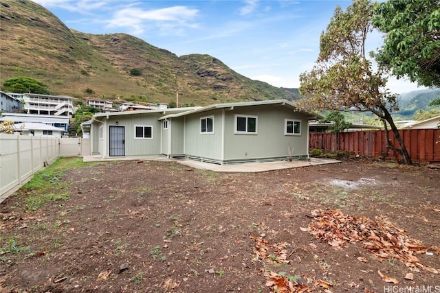 back of property with a mountain view