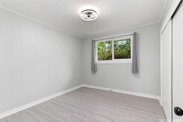 unfurnished room with light hardwood / wood-style floors