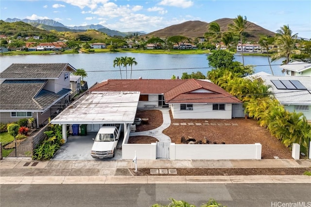 drone / aerial view featuring a water and mountain view