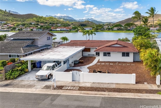 view of front of home featuring a water and mountain view