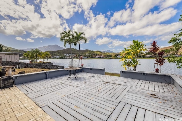 dock area featuring a deck with water view