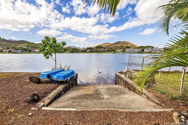 dock area featuring a water and mountain view