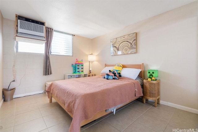 tiled bedroom featuring a wall unit AC