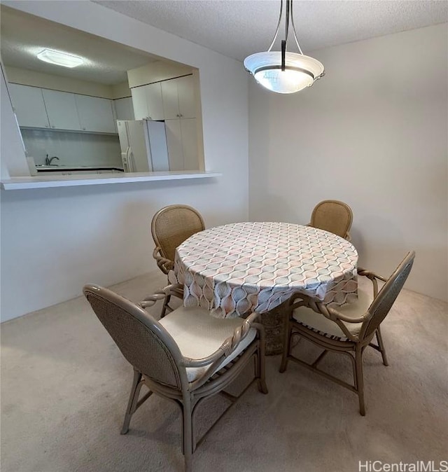 view of carpeted dining area