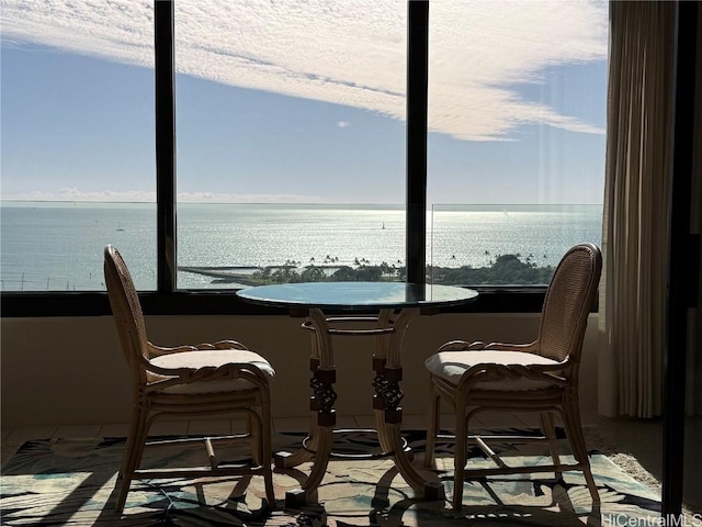 dining space with a water view