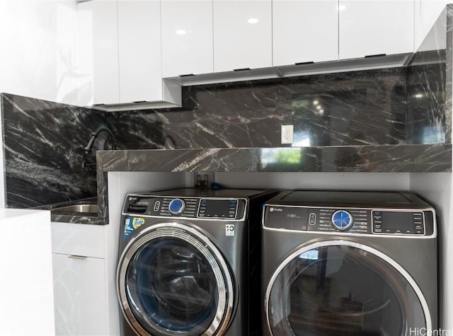 laundry room featuring laundry area and washing machine and dryer