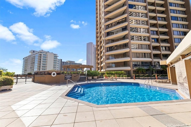 view of swimming pool featuring a patio