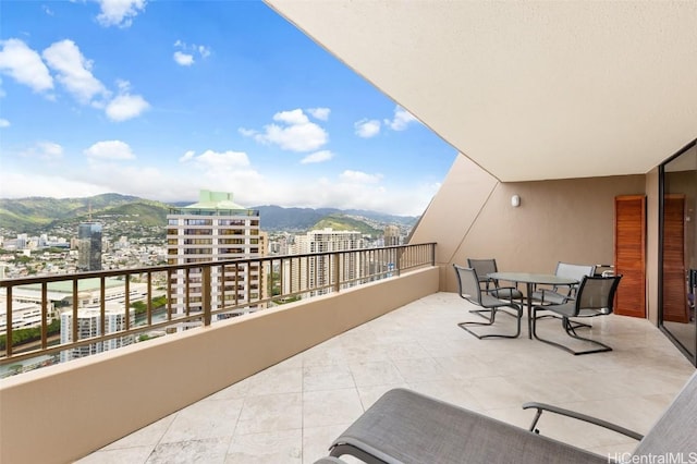 balcony featuring a mountain view