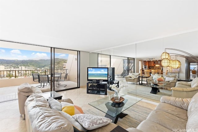 tiled living room featuring a wall of windows