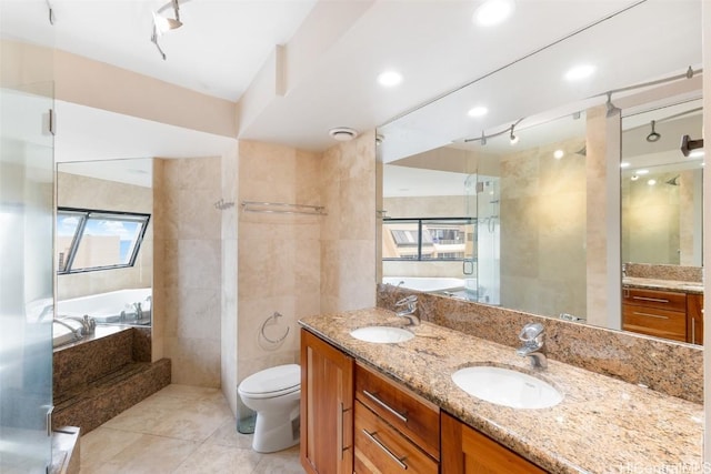 full bathroom with tile walls, vanity, tile patterned floors, independent shower and bath, and toilet