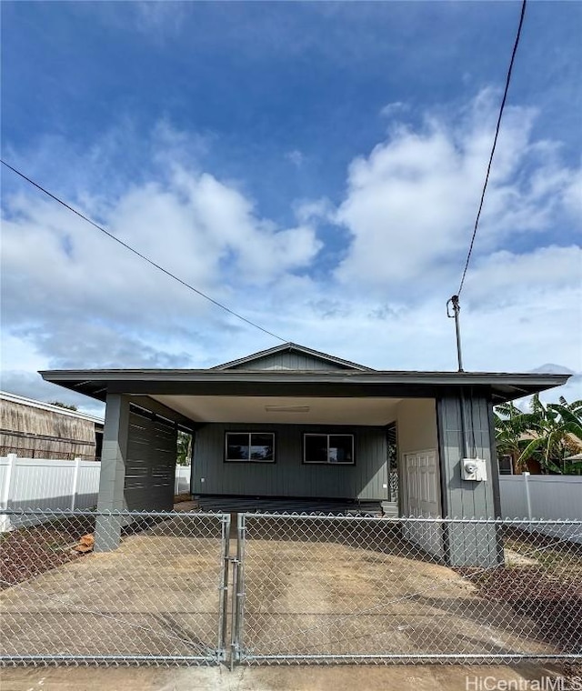 view of front of home featuring a carport