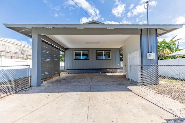 exterior space with a carport