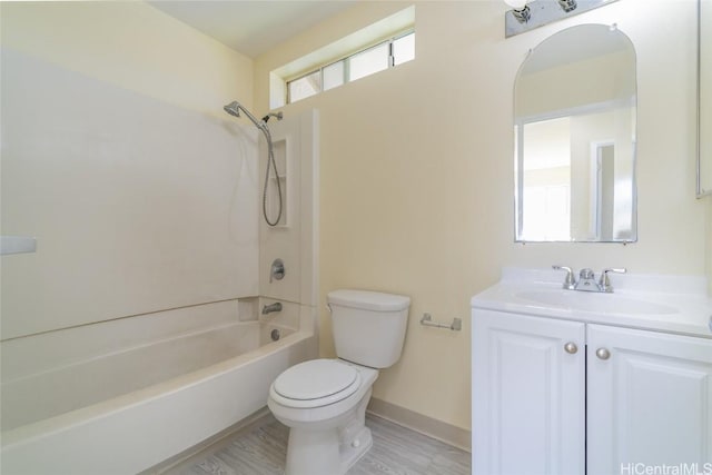 full bathroom featuring hardwood / wood-style floors, toilet, vanity, and bathing tub / shower combination