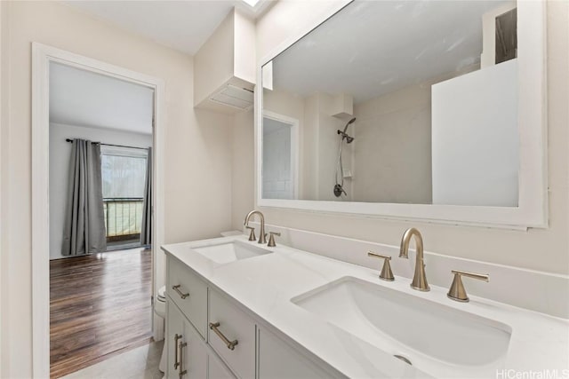 bathroom featuring hardwood / wood-style flooring and vanity