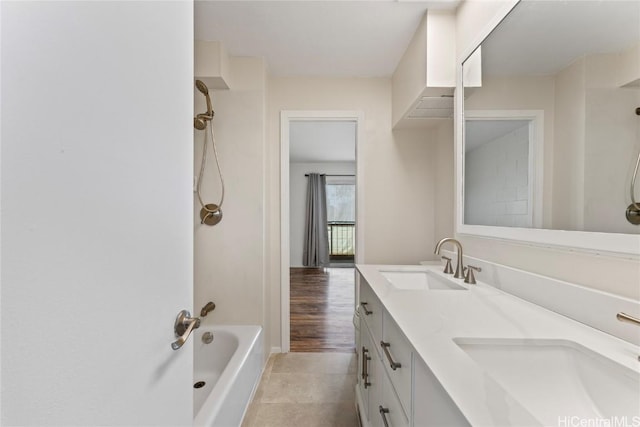 bathroom featuring vanity and tub / shower combination