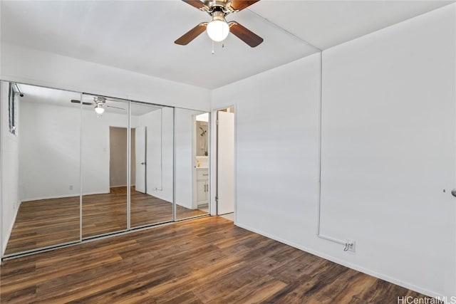 unfurnished bedroom with dark hardwood / wood-style flooring and ceiling fan