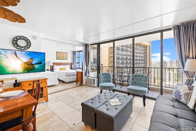 living room with tile patterned floors and floor to ceiling windows