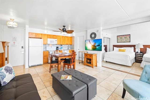 living room with light tile patterned flooring and ceiling fan