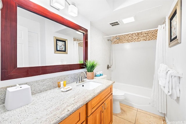 full bathroom with tile patterned floors, toilet, vanity, and shower / bath combo