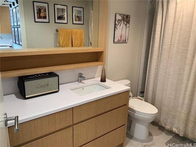 bathroom with vanity, tile patterned floors, and toilet