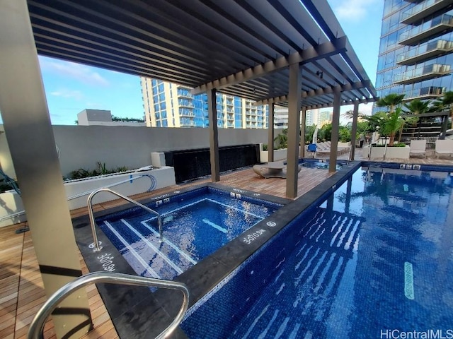 view of pool with a community hot tub and a pergola