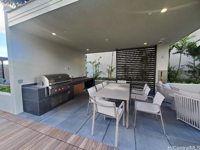 view of patio / terrace with area for grilling and a grill